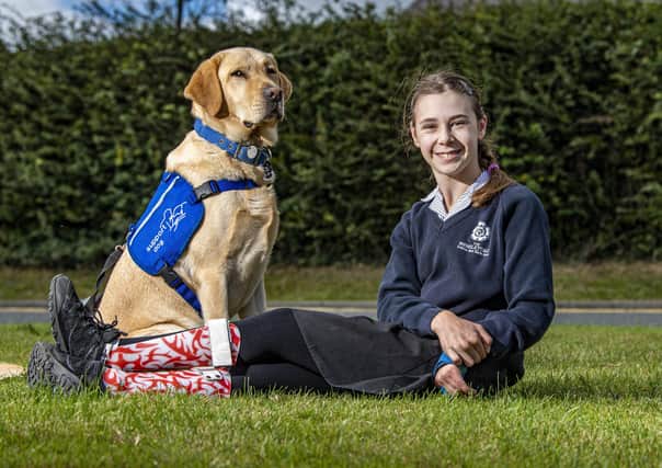 Molly Birch with her support dog Chess at Wensleydale School. Photo: Tony Johnson.