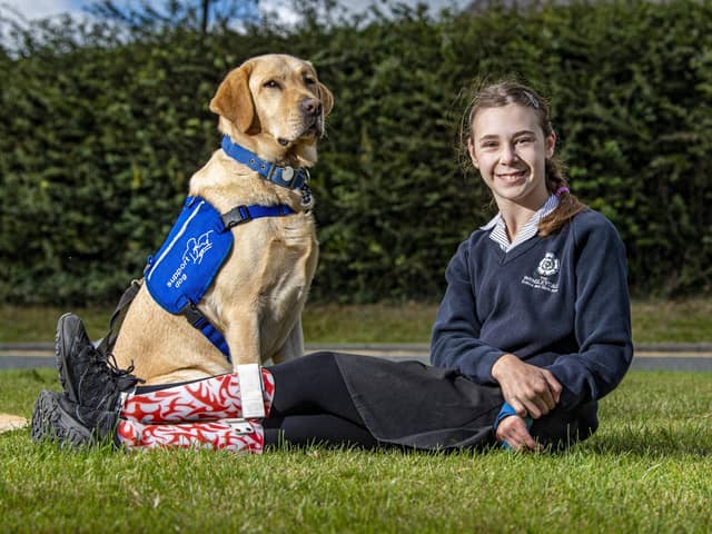 Molly Birch with her support dog Chess at Wensleydale School. Photo: Tony Johnson.