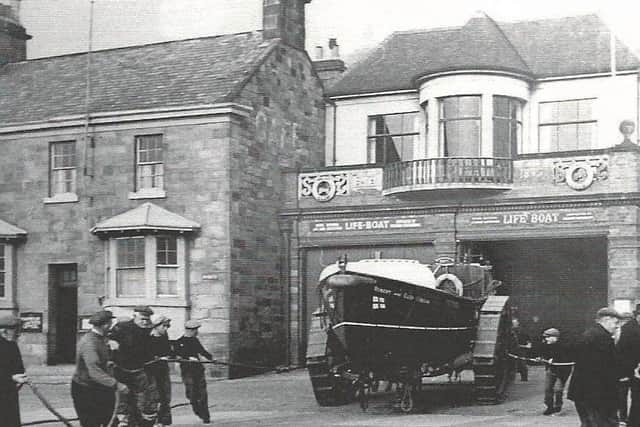 Historic image of the 'Robert & Ellen Robson' lifeboat being pulled out in 1953