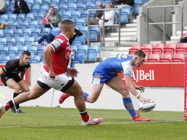 AIMING HIGH: Leeds Rhinos' Jack Broadbent scores his team's fifth try against Salford in June this year. Picture by Ed Sykes/SWpix.com