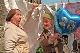 Nora Batty (Kathy Staff) gets a shock as Compo (Bill Owen) leaps from behind her washing to surprise her, as the cast of Last of the Summer Wine assembled in Homfirth on for filming of the 25th anniversary series. Picture: Mark Bickerdike.