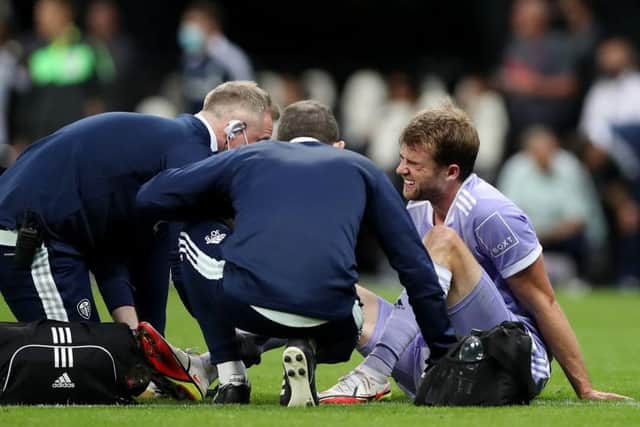 INJURY: Leeds United's Patrick Bamford receives treatment at Newcastle United