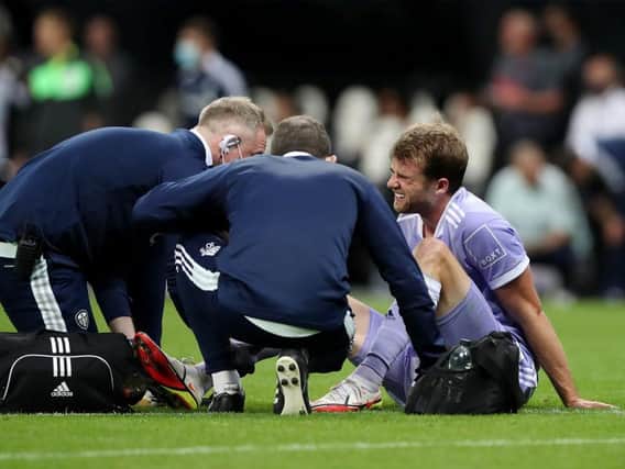 INJURY: Leeds United's Patrick Bamford receives treatment at Newcastle United