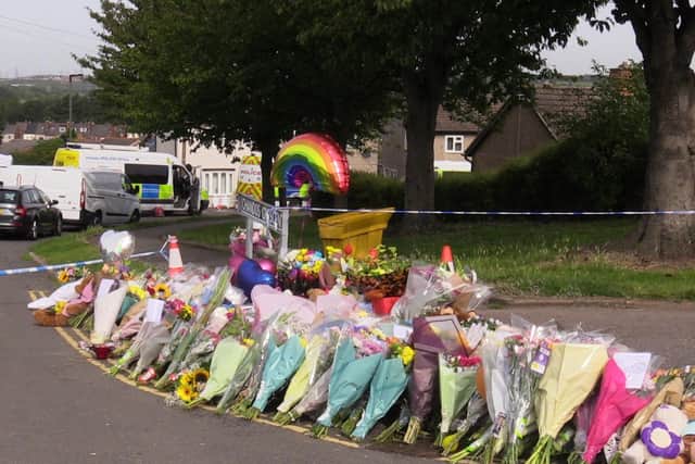 Flowers near to the scene in Chandos Crescent, Killamarsh, near Sheffield, where the bodies of John Paul Bennett, 13, Lacey Bennett, 11, their mother Terri Harris, 35, and Lacey’s friend Connie Gent, 11, were discovered at a property on Sunday morning.