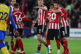Enda Stevens is congratulated by Sheffield United team-mate Jayden Bogle after his opener at Bramall Lane. Picture: SPORTIMAGE.