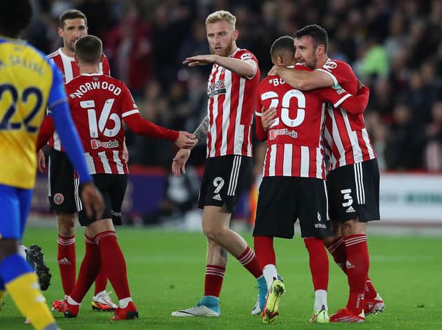 Enda Stevens is congratulated by Sheffield United team-mate Jayden Bogle after his opener at Bramall Lane. Picture: SPORTIMAGE.