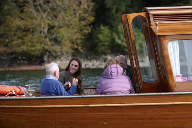 The Duchess of Cambridge (centre) meets Ike Alter and Diane Stoller in the steam launch Osprey on Windermere