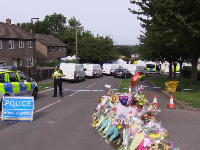 Flowers near to the scene in Chandos Crescent, Killamarsh, near Sheffield, where the bodies of John Paul Bennett, 13, Lacey Bennett, 11, their mother Terri Harris, 35, and Lacey’s friend Connie Gent, 11, were discovered at a property on Sunday morning