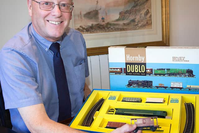 Auctioneer Graham Paddison cataloguing one of the later sets of Hornby Dublo, collected by the late Adrian Batty
