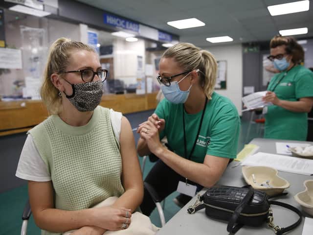 Covid-19 vaccinations under way. Photo by Hollie Adams/Getty Images.