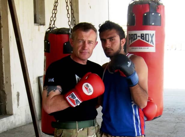 Former sergeant major Rob Smith with Omar in Afghanistan