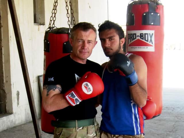 Former sergeant major Rob Smith with Omar in Afghanistan
