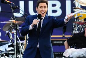 Rob Brydon on stage outside Buckingham Palace during the Diamond Jubilee Concert in 2012. Picture: Ian West/PA Wire.