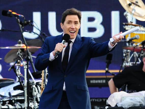 Rob Brydon on stage outside Buckingham Palace during the Diamond Jubilee Concert in 2012. Picture: Ian West/PA Wire.