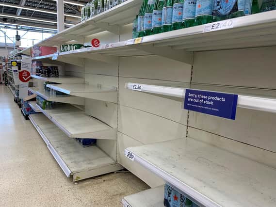 File photo dated 23/07/21 of empty shelves in the water aisle of the Tesco store at St Rollox in Glasgow. (PA/Andrew Milligan)