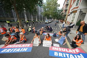 Protesters from Insulate Britain block a road outside the Home Office in central London (Yui Mok/PA)