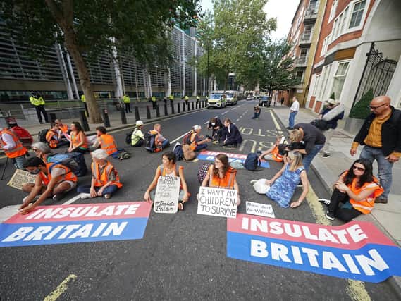 Protesters from Insulate Britain block a road outside the Home Office in central London (Yui Mok/PA)