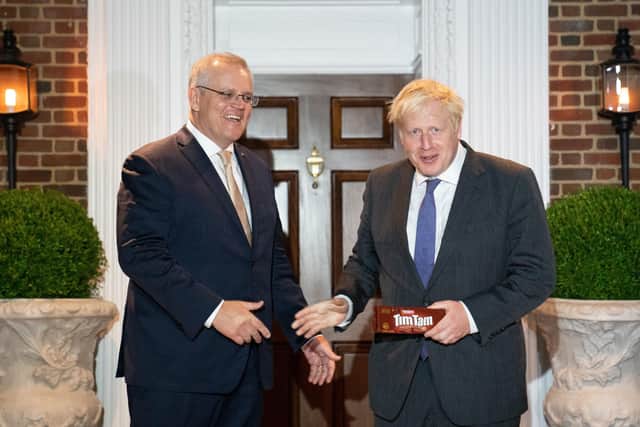 Prime Minister Boris Johnson is given a packet of the Australian snack, Tim Tams as he is greeted by his Australian counterpart, Scott Morrison in Washington DC, during his visit to the United States for the United Nations General Assembly.