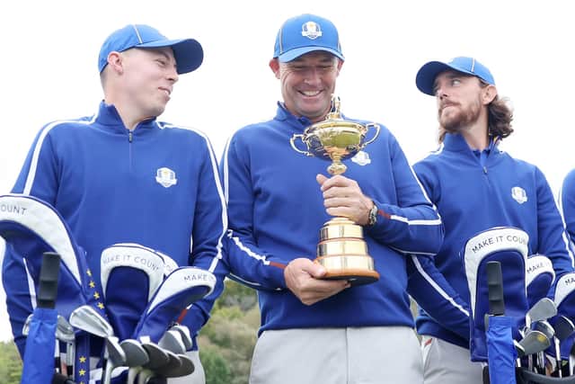Captain Padraig Harrington of Ireland and team Europe (C) holds the Ryder Cup as Matthew Fitzpatrick of England and team Europe (L) and Tommy Fleetwood of England and team Europe (R) look on. (Picture: Warren Little/Getty Images)