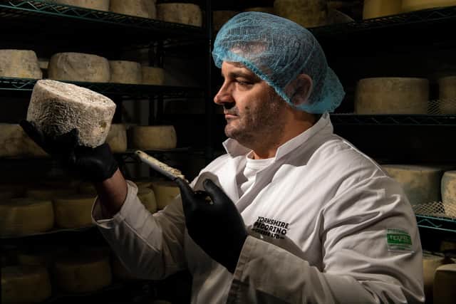 Mario  Olianas checking on a Leeds Blue cheese. Picture Bruce Rollinson