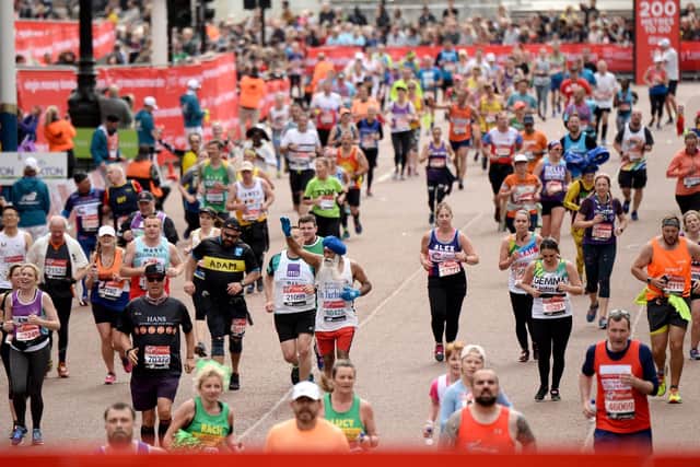 Runners compete during the Virgin London Marathon 2019. Photo by Jeff Spicer/Getty Images.