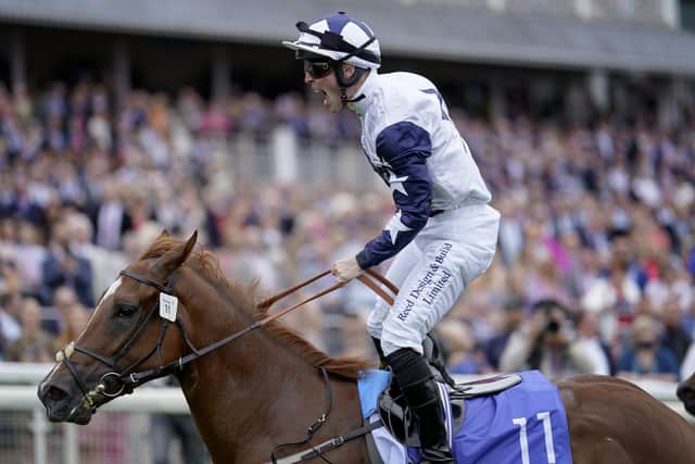 Ray Dawson celebrates as he rides Zain Claudette to victory in The Sky Bet Lowther Stakes at York Racecourse.