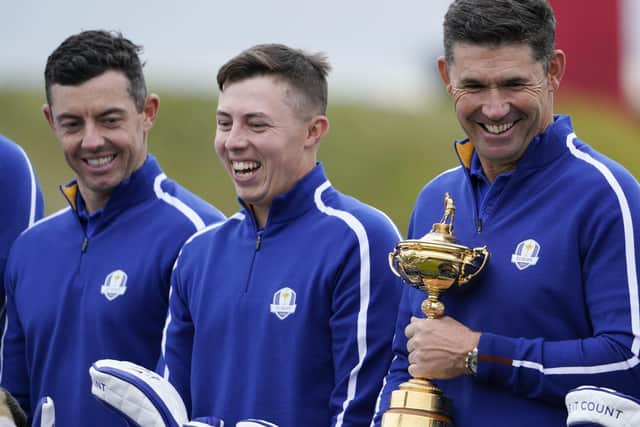 Matt Fitzpatrick, centre, shares a joke with Europe team captain Padraig Harrington, right, and team-mate Rory McIlroy at Whistling Straits Picture: AP/Jeff Roberson
