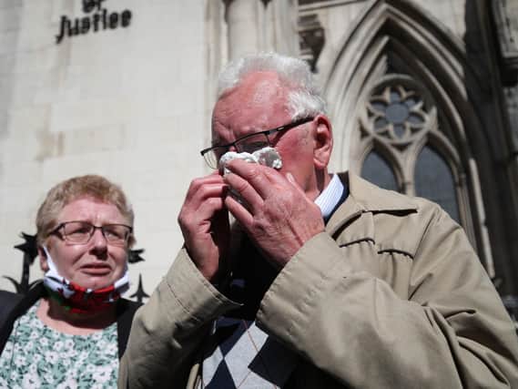 Former post office worker Noel Thomas, who was convicted of false accounting in 2006, celebrates with his daughter Sian outside the Royal Courts of Justice, London, after having his conviction overturned by the Court of Appeal in April. Picture: PA