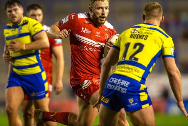 Hull KR's Will Maher takes on Warrington.  (BRUCE ROLLINSON)