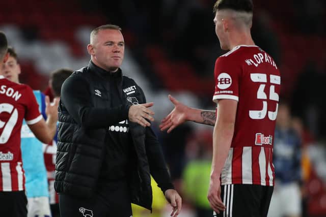 Wayne Rooney manager of Derby County congratulates Kacper Lopata of Sheffield Utd during the Carabao Cup match at Bramall Lane, Sheffield. (Picture: Alistair Langham / Sportimage)