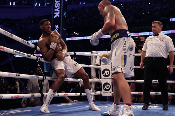 ROCKED: Oleksandr Usyk puts Anthony Joshua near the end of the heavyweight bout. Picture: Getty Images.