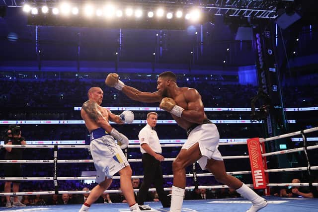 WAYWARD: Oleksandr Usyk ducks as Anthony Joshua punches. Picture: Getty Images.
