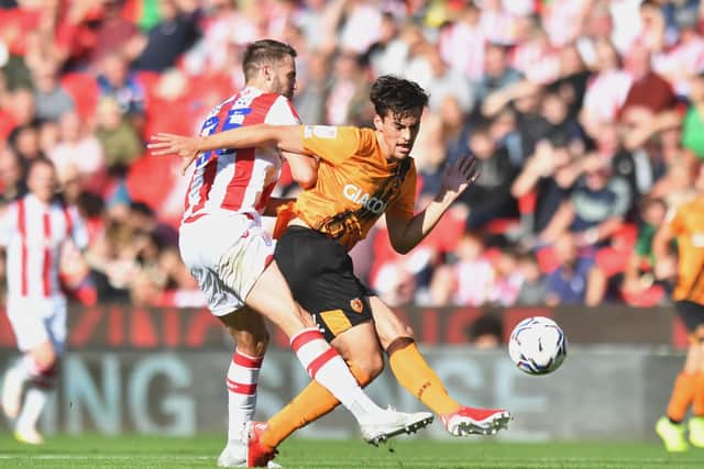 TOUGH DAY: Hull City's Jacob Greaves (right) is tackled by Stoke City's Nick Powell at the bet365 Stadium  Picture: Anthony Devlin/PA