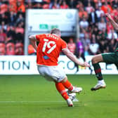 Blackpool's Shayne Lavery (left) scores his side's winning goal at Bloomfield Road Picture: Tim Markland/PA