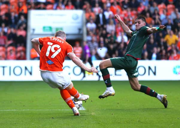 Blackpool's Shayne Lavery (left) scores his side's winning goal at Bloomfield Road Picture: Tim Markland/PA