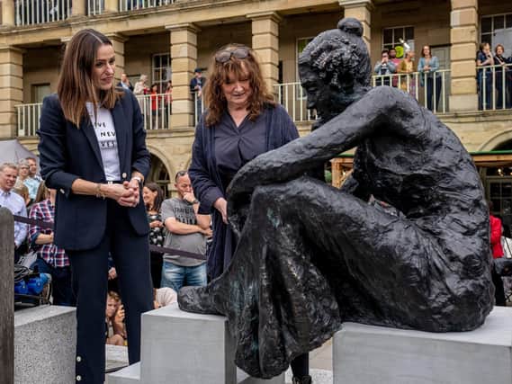 Gentleman Jack star Suranne Jones (left) and sculptor Diane Lawrenson unveil a newly-created interpretation of Anne Lister, at The Piece Hall Credit: Charlotte Graham