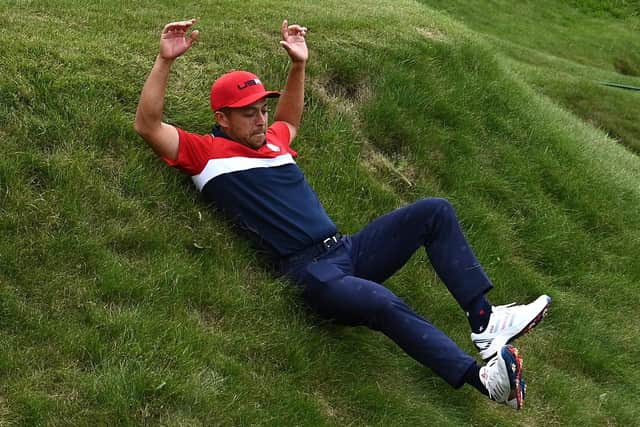 Rookie Xander Shauffele slides down a hill in celebration (Picture: PA)