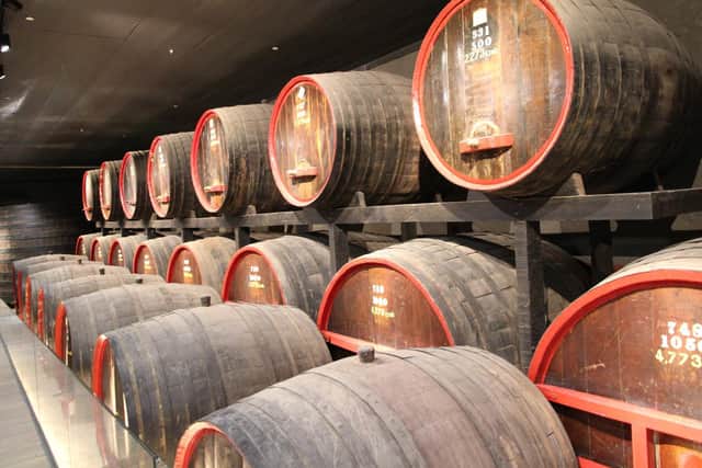 Barrels of wine ageing in Penfolds’ cellars.