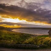 The sunsets over High Laith cruck barn on the shores of Grimwith Reservoir near Grassington. Picture: Tony Johnson.
