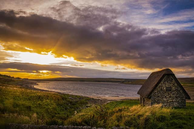 The sunsets over High Laith cruck barn on the shores of Grimwith Reservoir near Grassington. Picture: Tony Johnson.