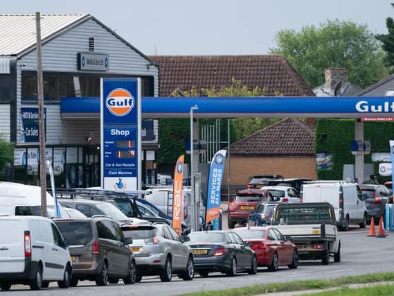 People queue for fuel at a petrol station in Barton, Cambridgeshire, during the national fuel crisis
