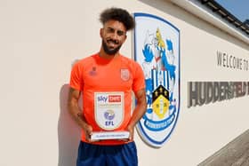 Huddersfield Town winger Sorba Thomas, pictured with his Championship player of the month award for August. Picture courtesy of EFL.