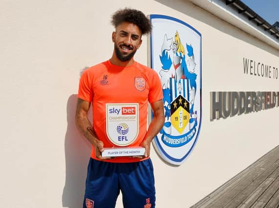 Huddersfield Town winger Sorba Thomas, pictured with his Championship player of the month award for August. Picture courtesy of EFL.