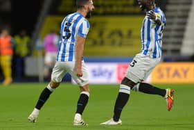 Alex Vallejo celebrates his opener for Huddersfield Town with team-mate Naby Sarr in an eventful game against Blackburn at the John Smith's Stadium. Picture: Bruce Rollinson.