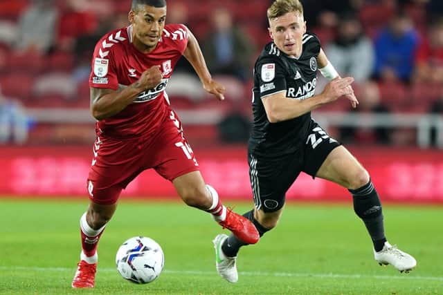 Duel: Middlesbrough's Lee Peltier, left, and Sheffield United's Ben Osborn battle for the ball during the hosts' 2-0 win. Picture: Owen Humphreys/PA Wire.