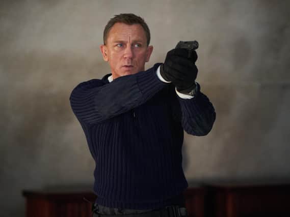 Daniel Craig playing James Bond in the new Bond film No Time To Die. (PA).