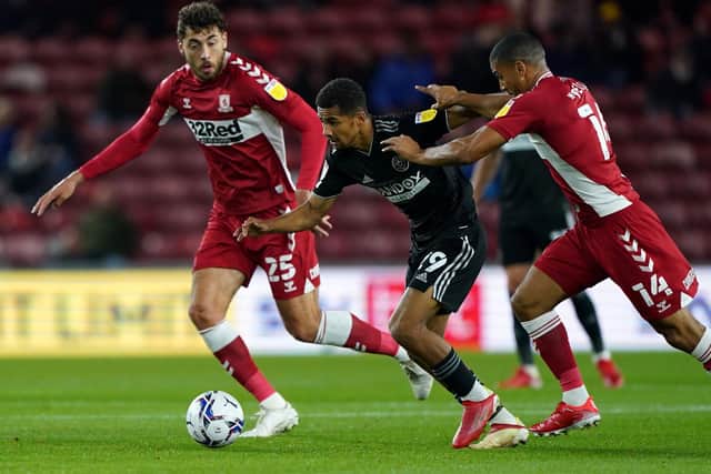 Sheffield United's Jack Robinson (centre) battles for the ball with Middlesbrough's Matt Crooks (left) and Lee Peltier (Picture: PA)