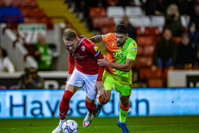Barnsley captain Cauley Woodrow is brought down by Nottingham Forest's Tobias Figueiredo for the penalty. Picture: Tony Johnson.