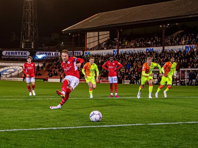 Spot-on. Cauley Woodrow puts Barnsley in front against Nottingham Forest. Picture: Tony Johnson.