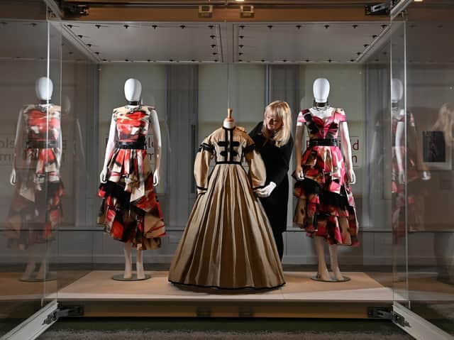 Belonging: Fashion & A Sense of Place at the Bankfield Museum, Halifax. Elinor Camille-Wood, Curator, with the Alexander McQueen dresses inspired by Wuthering Heights and the dress from the Brontes' era.